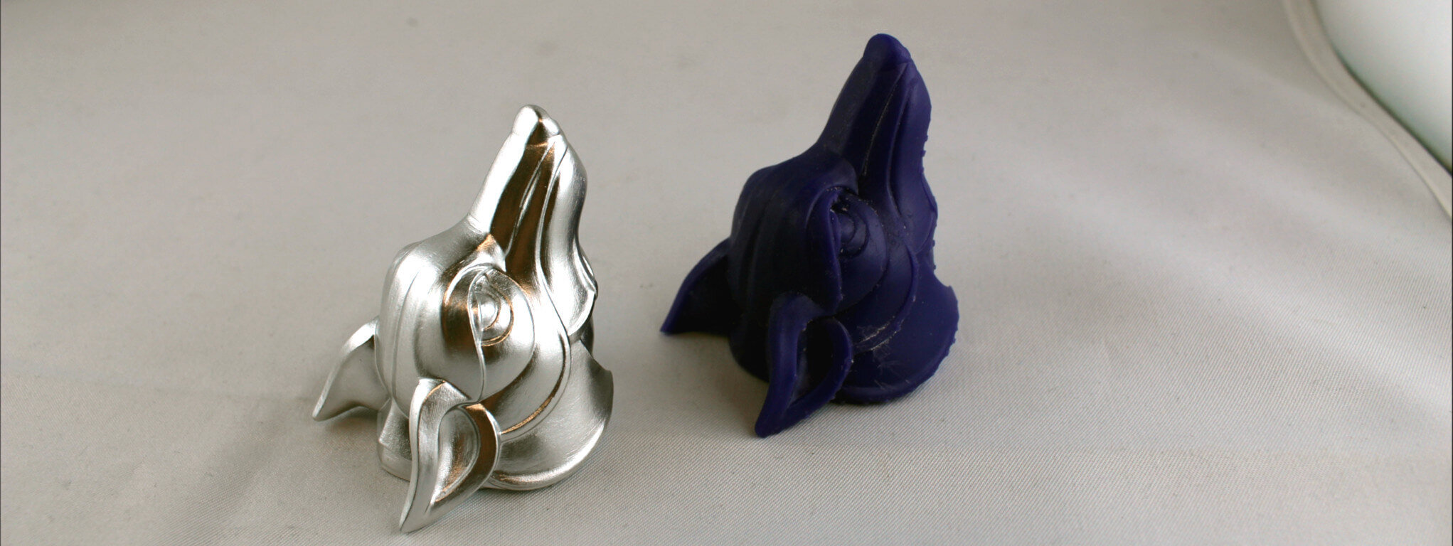 Alle 3D-Druck Verfahren zusammengefasst: Zwei Hundeköpfe im Lost Wax 3D-Druck Verfahren gefertigt